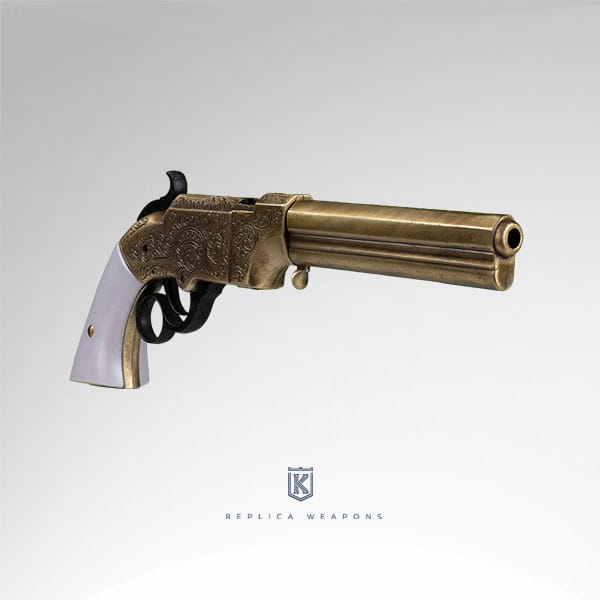 Vista perfil derecho de réplica de pistola Volcanic 1854 de Smith & Wesson con cañón y cuerpo de metal dorado envejecido y cachas de nácar.
