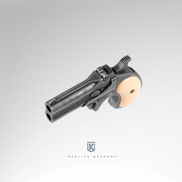 Réplica perspectiva izquierdo surperior de pistola Derringer con empuñadura de imitación marfil y cuerpo metálico