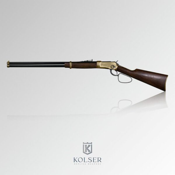 Vista lateral izquierda de réplica de rifle winchester long range 1892 de 108 cm con caja de mecanismos en color latón.